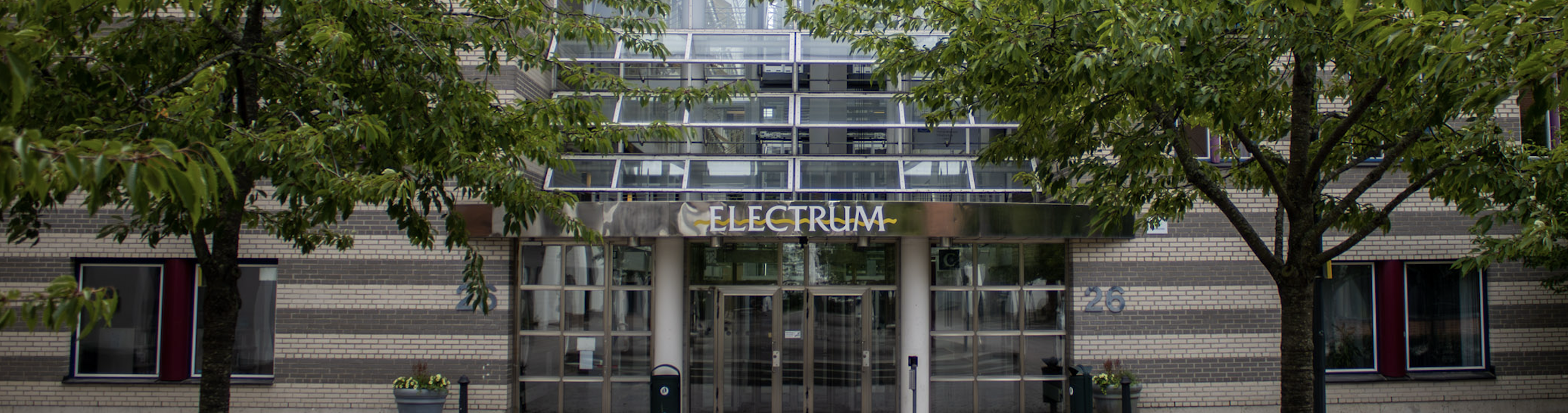 Electrums glass entrance from the western boules court area.